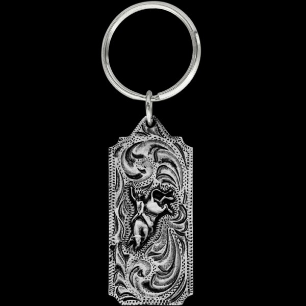 Hold onto the excitement of the arena with our Bull Rider Keychain. Precision-crafted, it's a fitting tribute to the courage and skill of rodeo athletes. Dive in now and capture the adrenaline of the bull riding experience in your keychain collection!